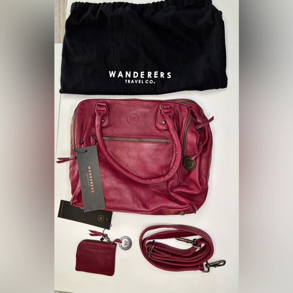 Wanderers Travel Co Women's Leather Bag
NWT. Burgundy/Dk pink